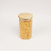 Glazen uitdeelpot geribbeld met houten deksel